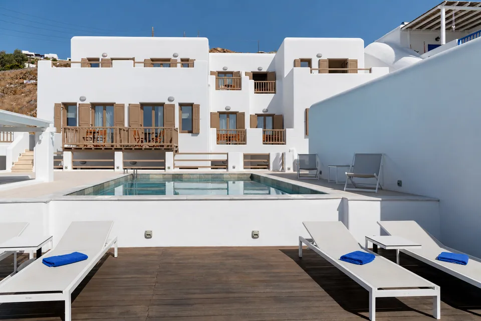 White Cycladic buildings around the Lithos swimming pool